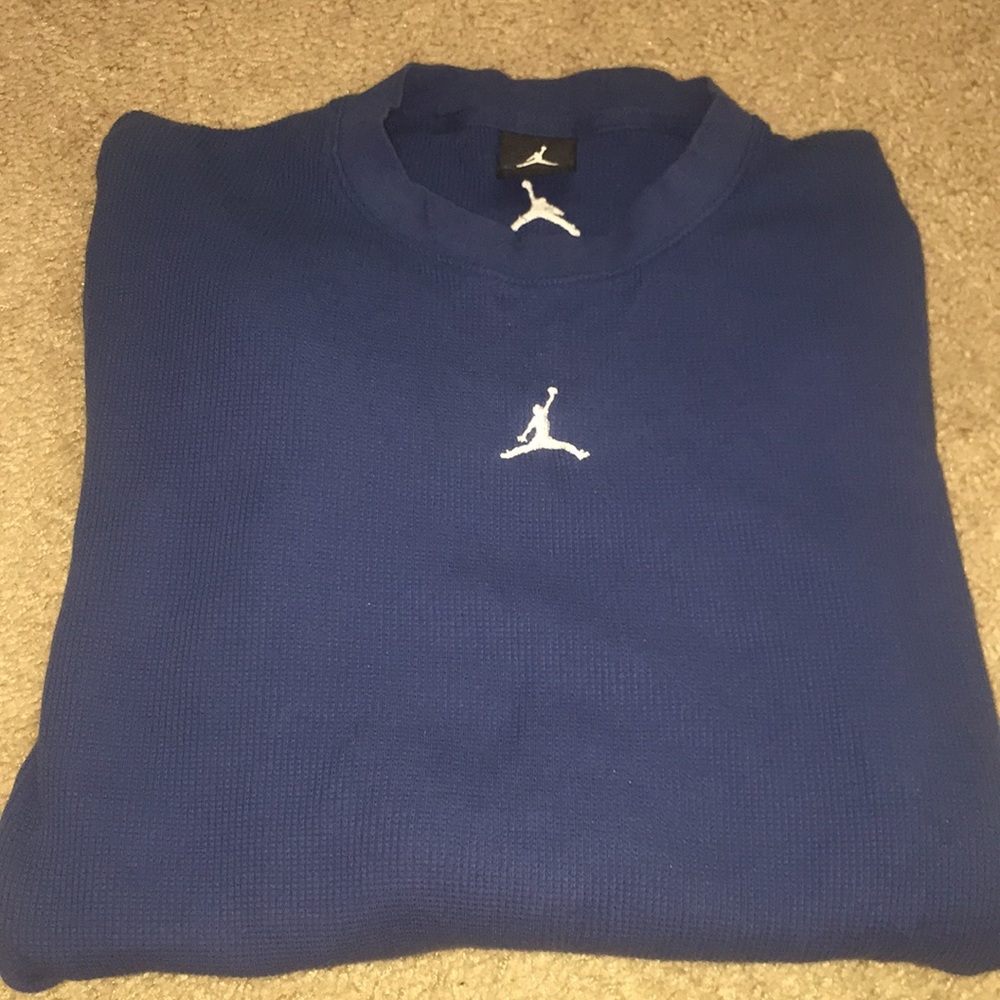 A blue long sleeve Jordan shirt
